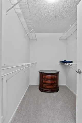 an aerial view of a house with a garden and swimming pool