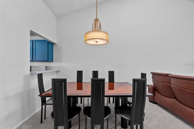 a spacious bathroom with a granite countertop sink and a toilet