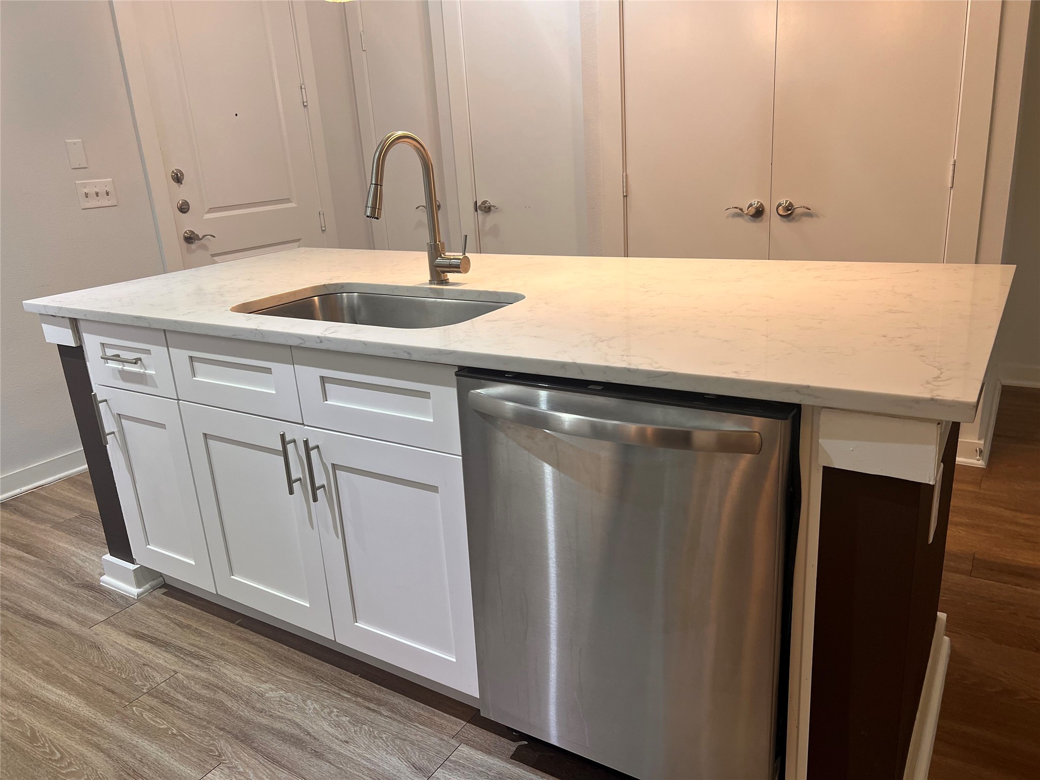 1900 Barton Springs Road, Unit 4041 Austin, TX 78704 - Photo 16 of 35 a kitchen with a sink and cabinets