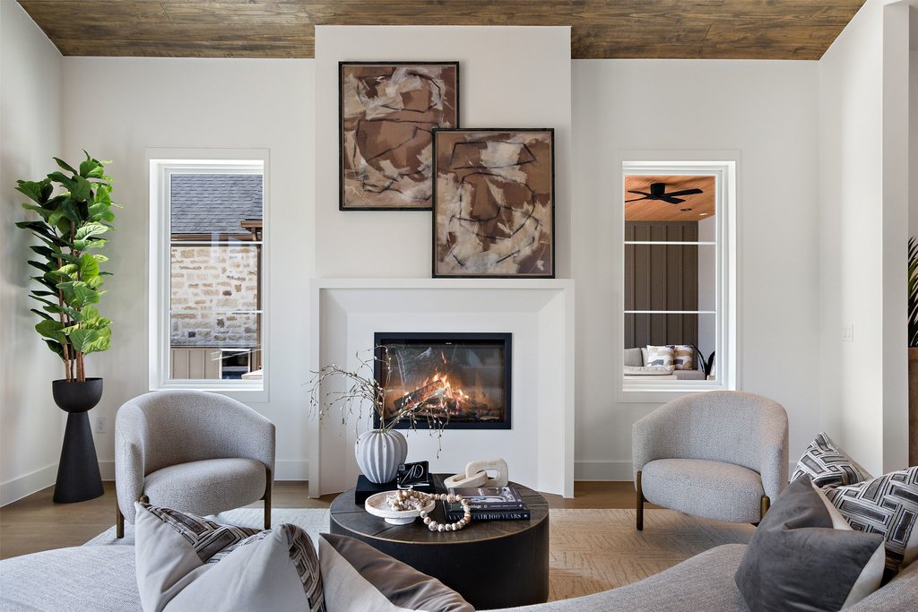 9207 Zyle Road Austin, TX 78737 - Photo 7 of 40 A striking fireplace forms the focal point of this inviting living area.