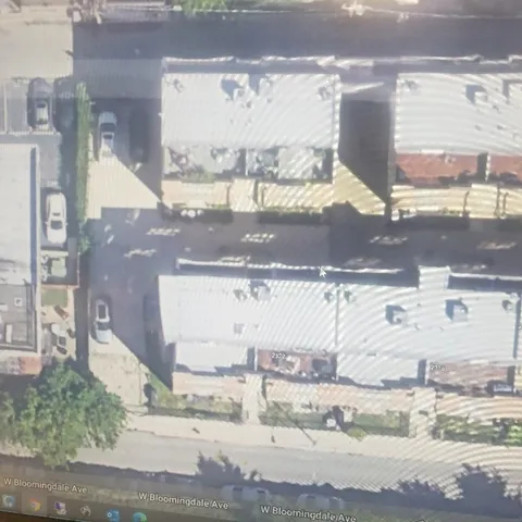a view of a building with wooden fence
