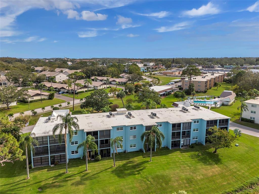 1430 Heather Ridge Boulevard, Unit 304 Dunedin, FL 34698 - Photo 36 of 36 an aerial view of a house with a garden space