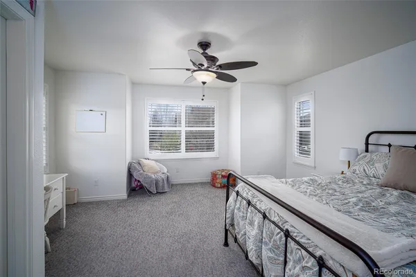 a bedroom with a bed and furniture