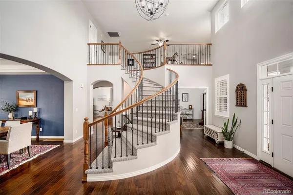 a view of entryway livingroom and hall with wooden floor