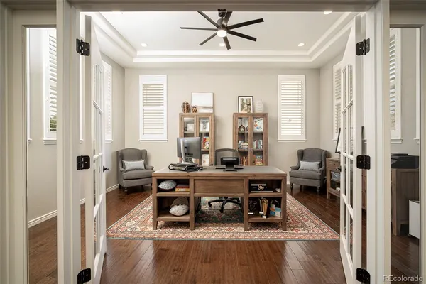 a living room with furniture a rug and a window