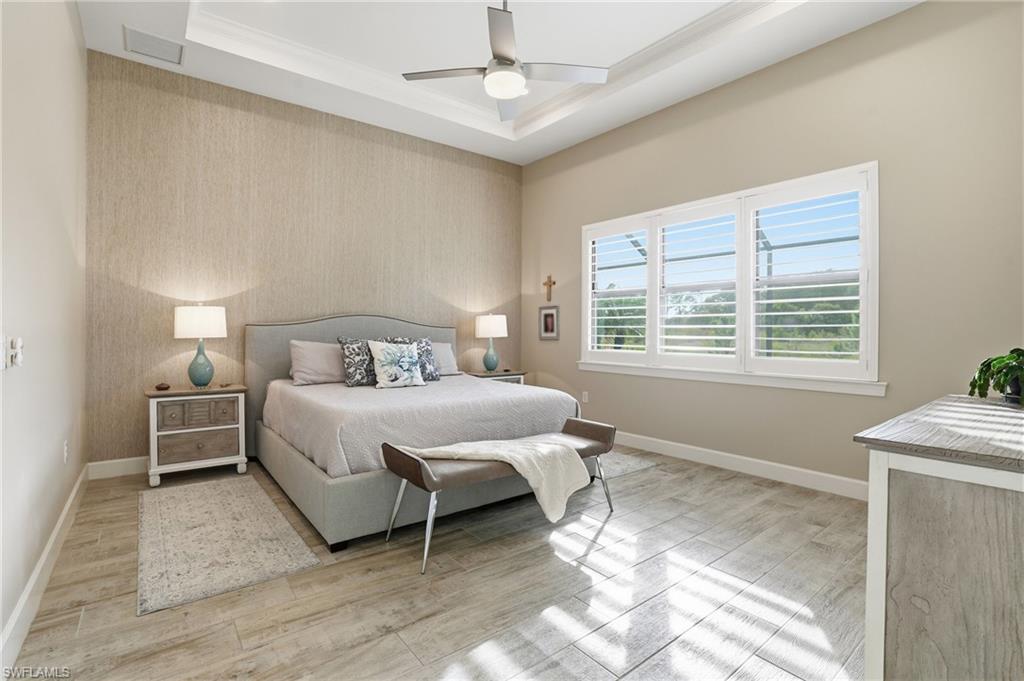 17210 Ashcomb Way Estero, FL 33928 - Photo 19 of 47 a bedroom with a bed and a window