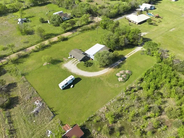 an aerial view of residential houses with outdoor space