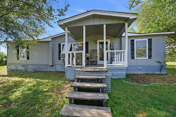 front view of a house with a yard