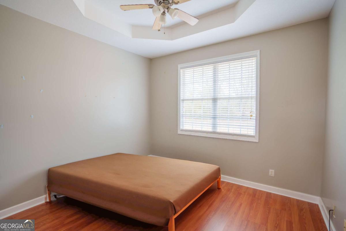 83 Gabriel Lane Baxley, GA 31513 - Photo 15 of 25 a bedroom with a bed and window