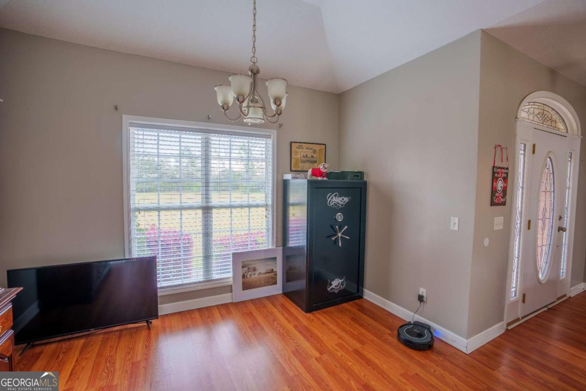 83 Gabriel Lane Baxley, GA 31513 - Photo 18 of 25 a view of livingroom with furniture wooden floor and window
