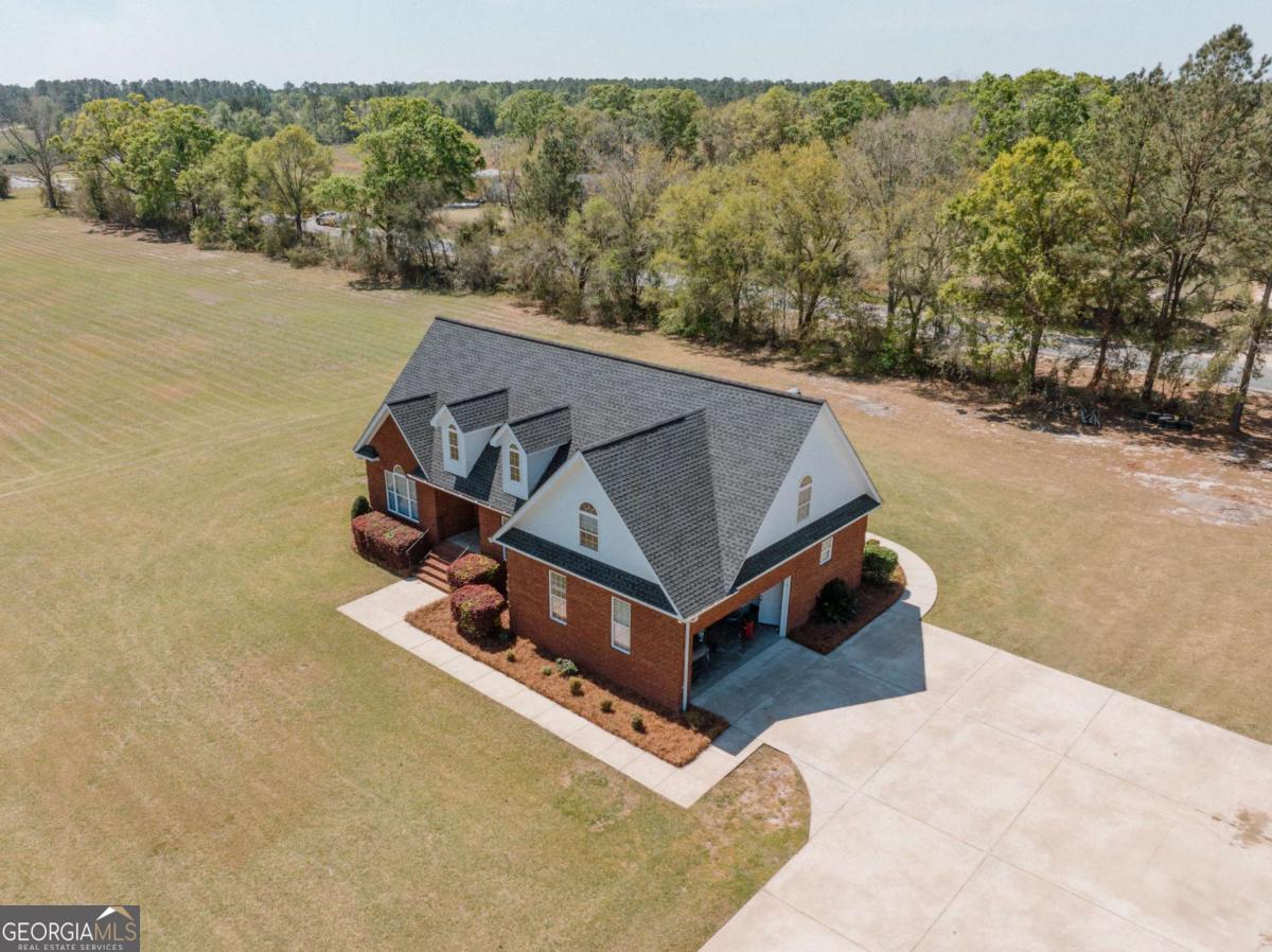 83 Gabriel Lane Baxley, GA 31513 - Photo 2 of 25 an aerial view of a house with a yard