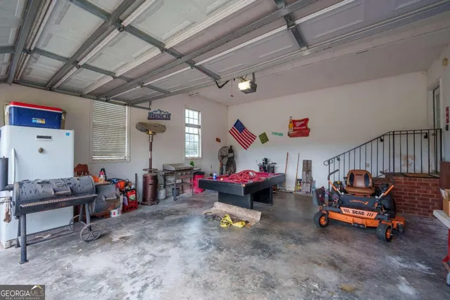 a living room with lots of furniture and a chandelier