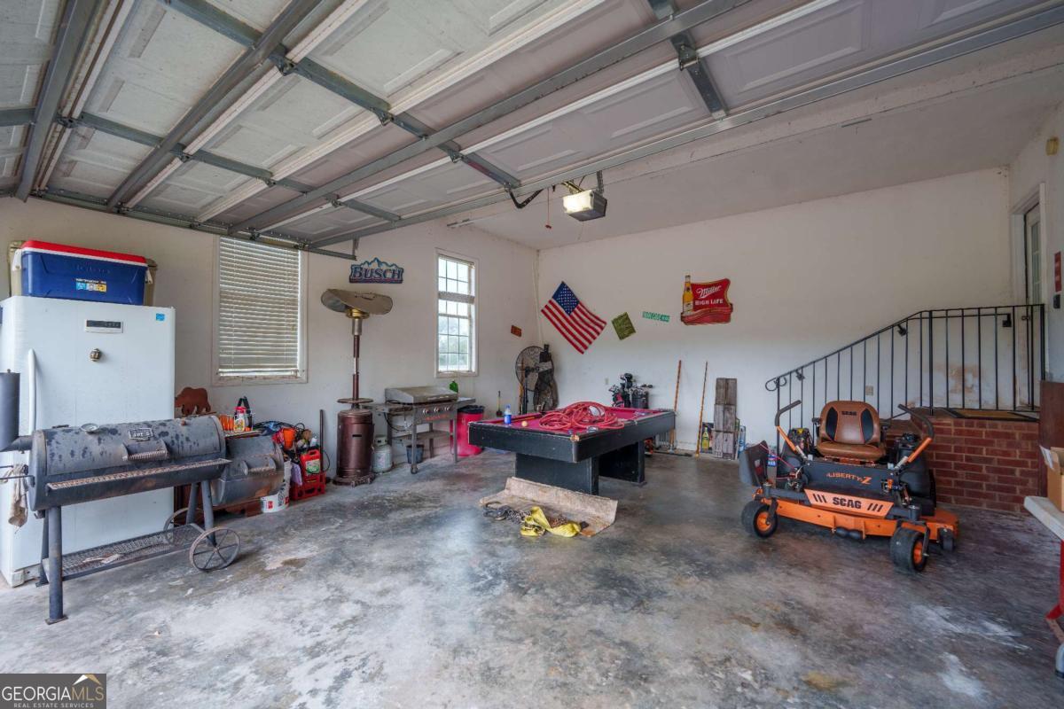 83 Gabriel Lane Baxley, GA 31513 - Photo 21 of 25 a living room with lots of furniture and a chandelier