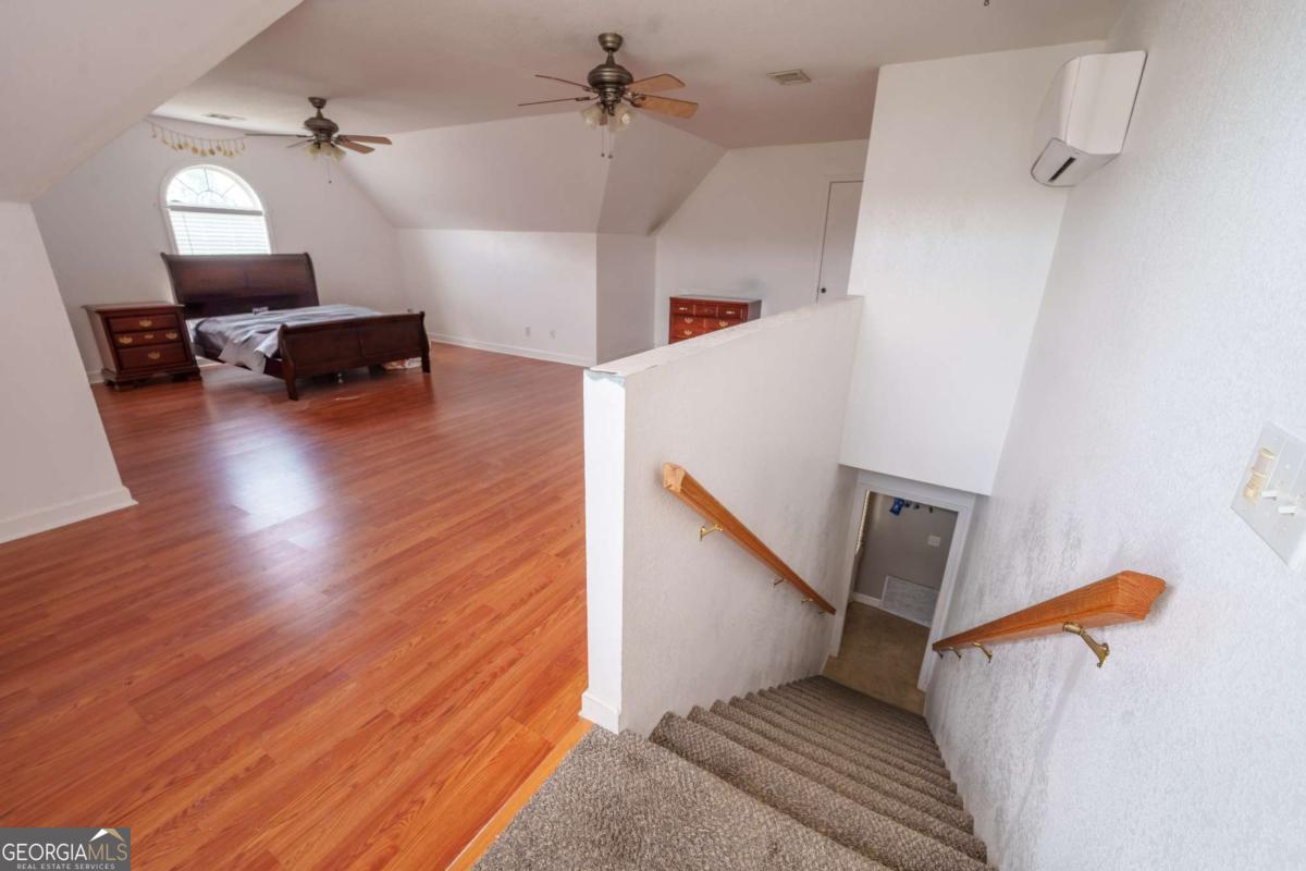 83 Gabriel Lane Baxley, GA 31513 - Photo 24 of 25 a view of a livingroom with furniture and a ceiling fan