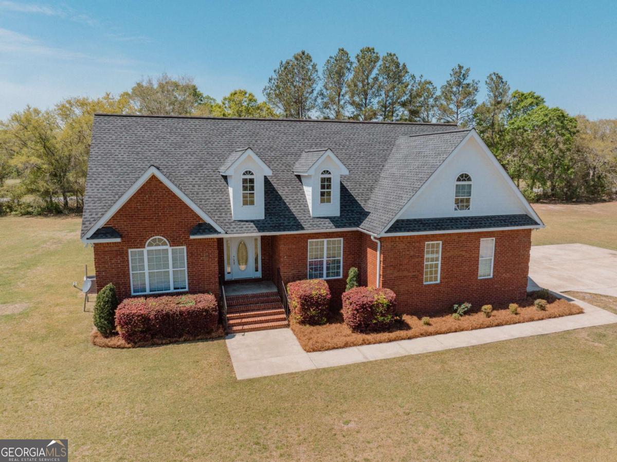 83 Gabriel Lane Baxley, GA 31513 - Photo 7 of 25 an aerial view of a house with yard