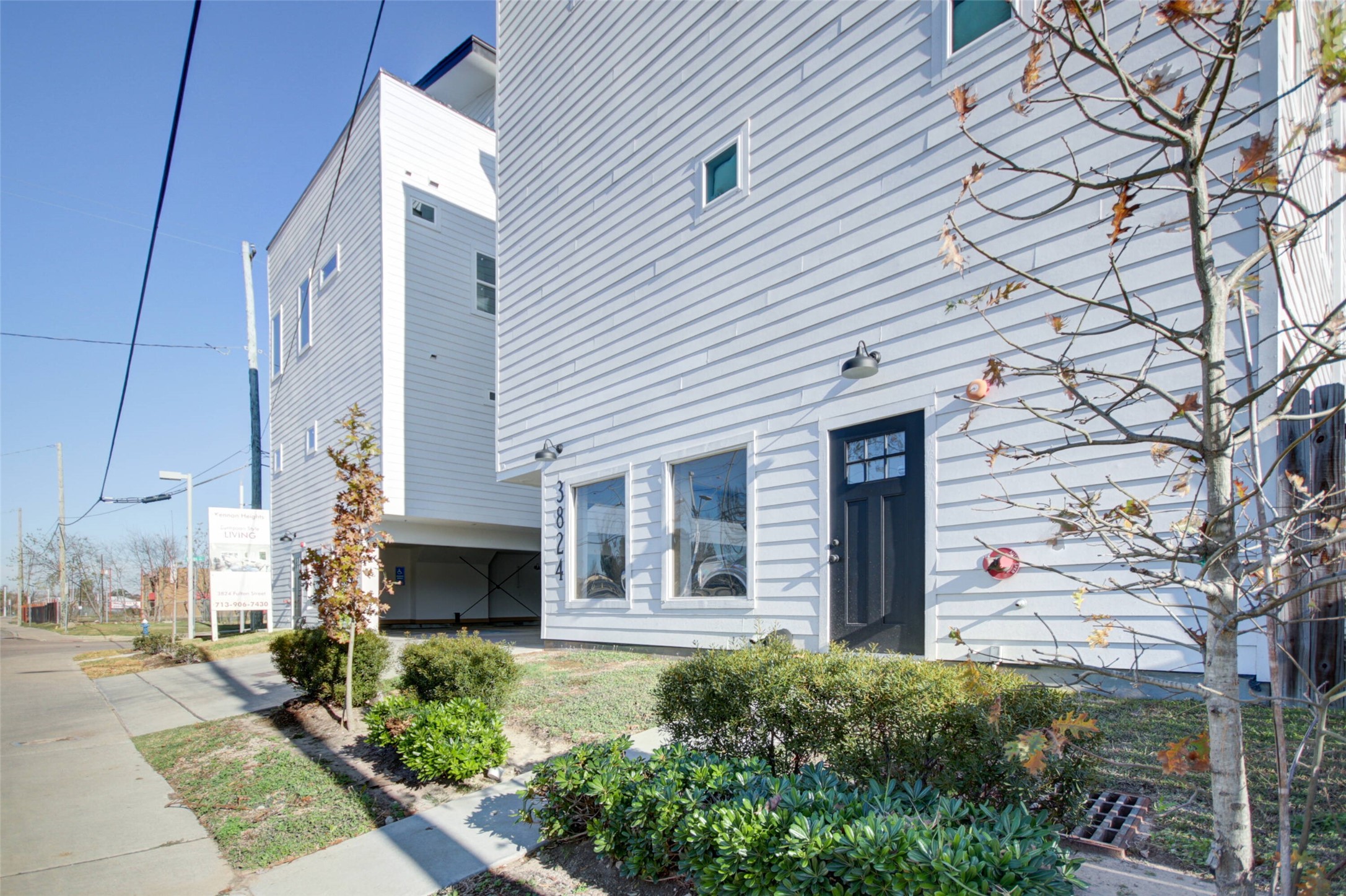 a front view of a house with trees