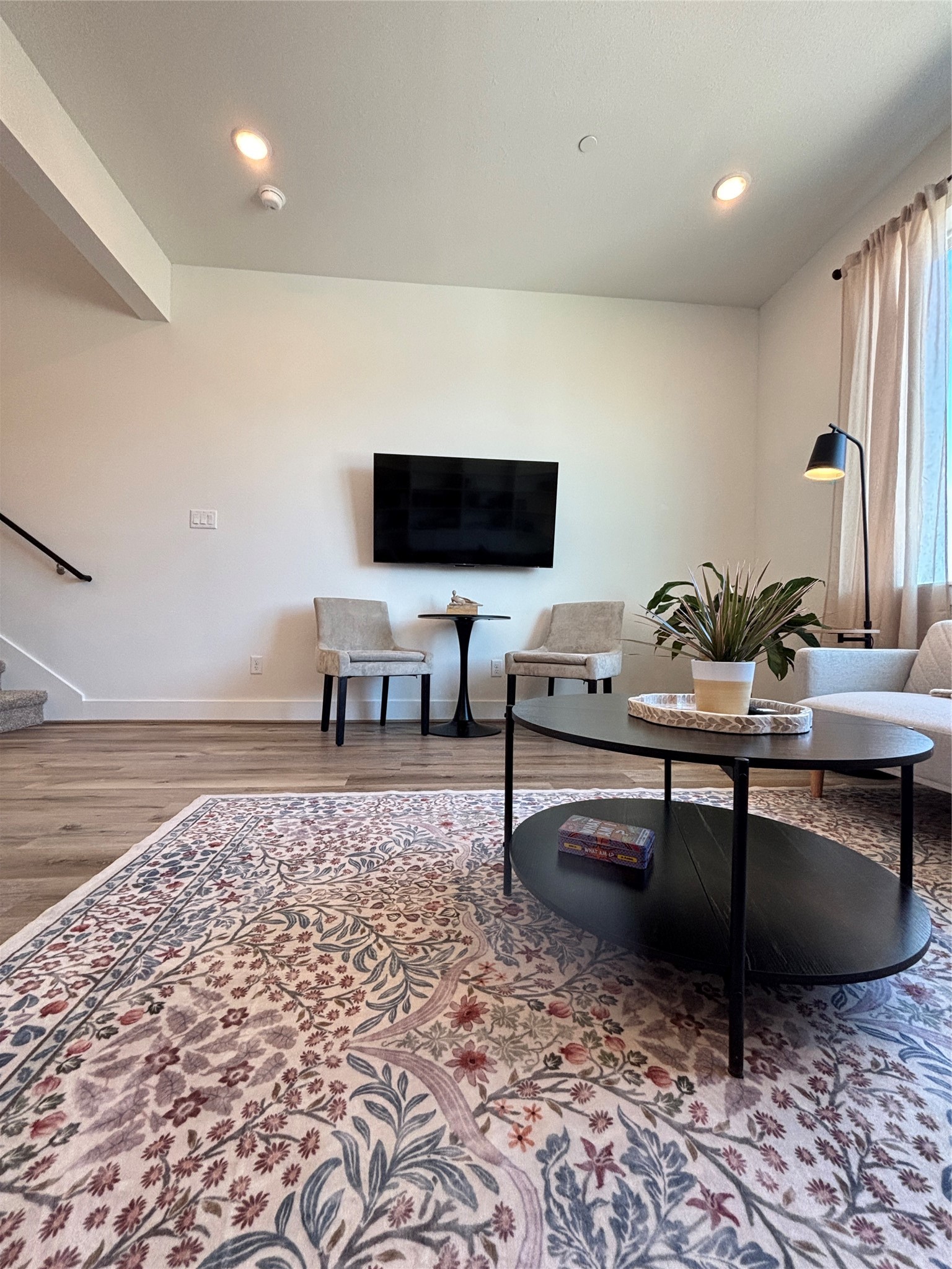 3824 Fulton Street, Unit 112 Houston, TX 77009 - Photo 8 of 15 a living room with couch and a flat screen tv