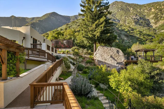 a view of a chairs and table in the patio