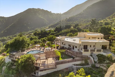 a view of a swimming pool with a patio