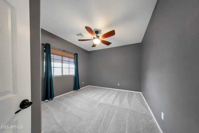 wooden floor in a room next to a window