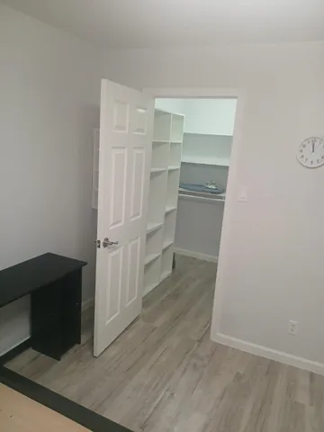 a view of an empty walk in closet