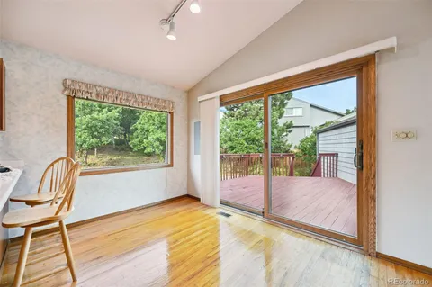 a large kitchen with stainless steel appliances granite countertop sink stove and refrigerator