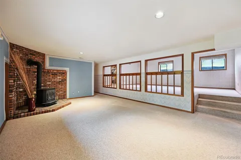 a livingroom with workspace and a couch