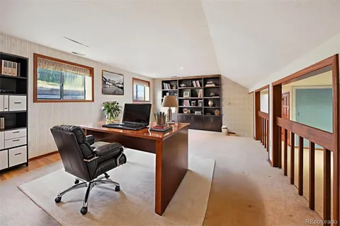 a view of an empty room with windows