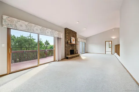 a view of empty room with floor to ceiling window