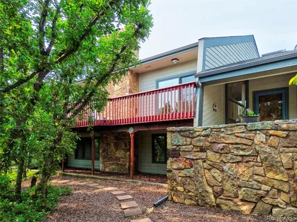 a view of brick house with a large window
