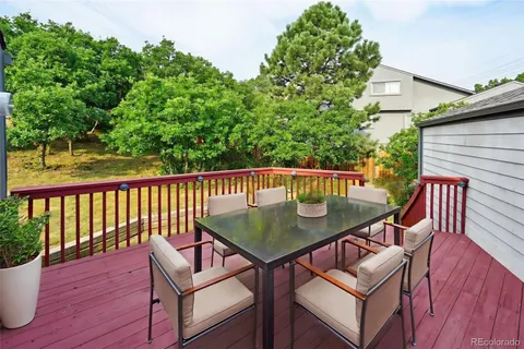 a view of a patio with two chairs and a table