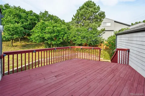 a view of backyard with a deck