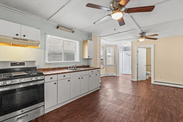 a kitchen with stainless steel appliances granite countertop a stove and a refrigerator