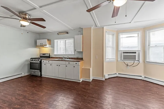 a kitchen with a refrigerator and window
