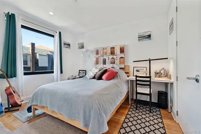 a bedroom with a bed and a dresser