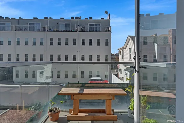 a view of building with yard and staircase