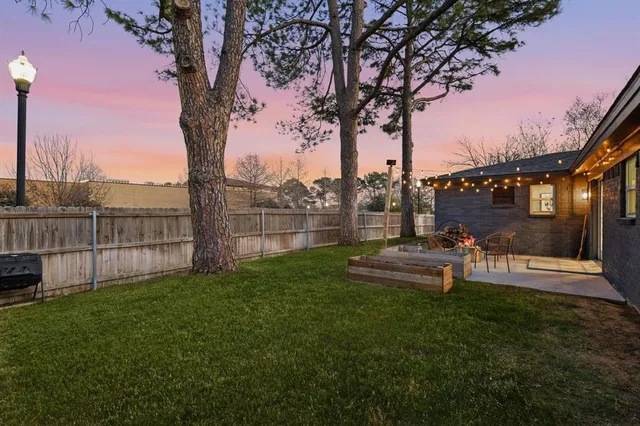 a view of a park with large trees