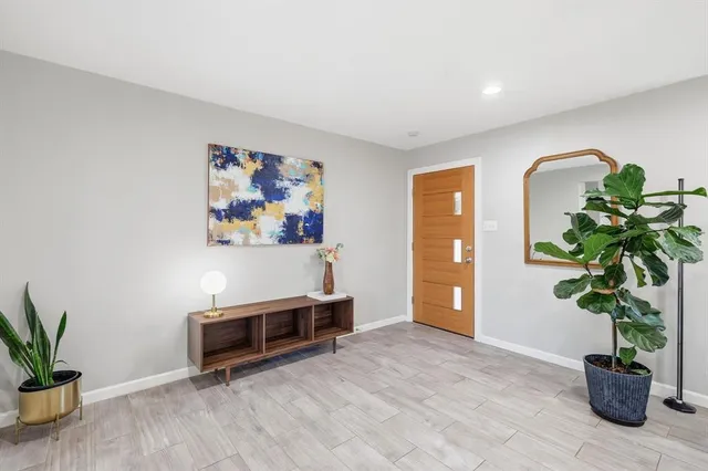 a living room with furniture potted plant and a potted plant