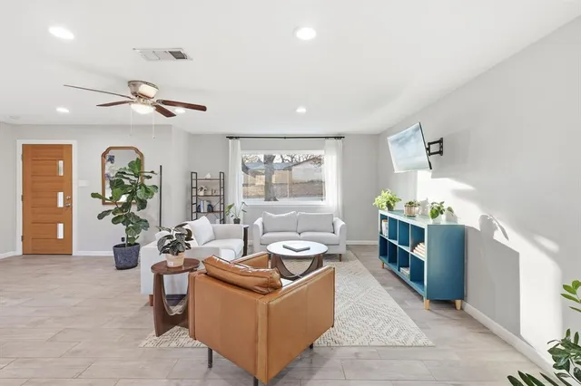 a living room with furniture and a window
