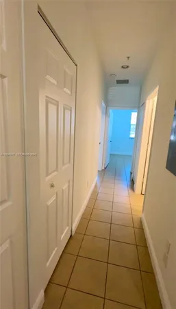 a bathroom with a granite countertop sink a toilet and mirror