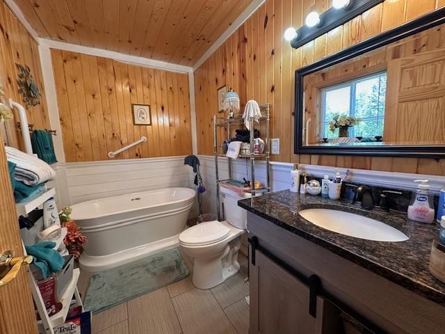 1383 Kelly Trail Isabella, MN 55607 - Photo 17 of 40 Full bath featuring a soaking tub, vanity, wood walls, and wooden ceiling