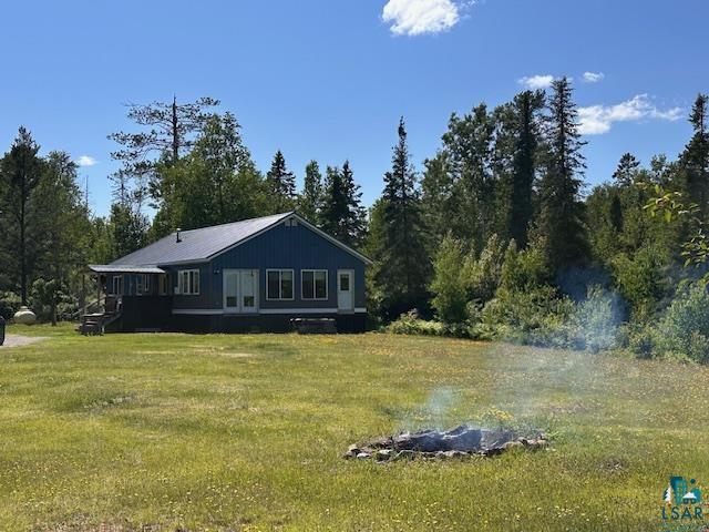 1383 Kelly Trail Isabella, MN 55607 - Photo 33 of 40 Rear view of house with a lawn