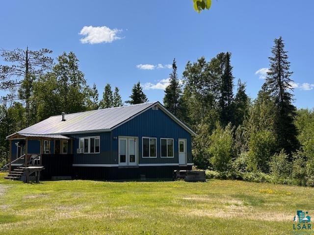 1383 Kelly Trail Isabella, MN 55607 - Photo 35 of 40 Rear view of property with a yard and a metal roof