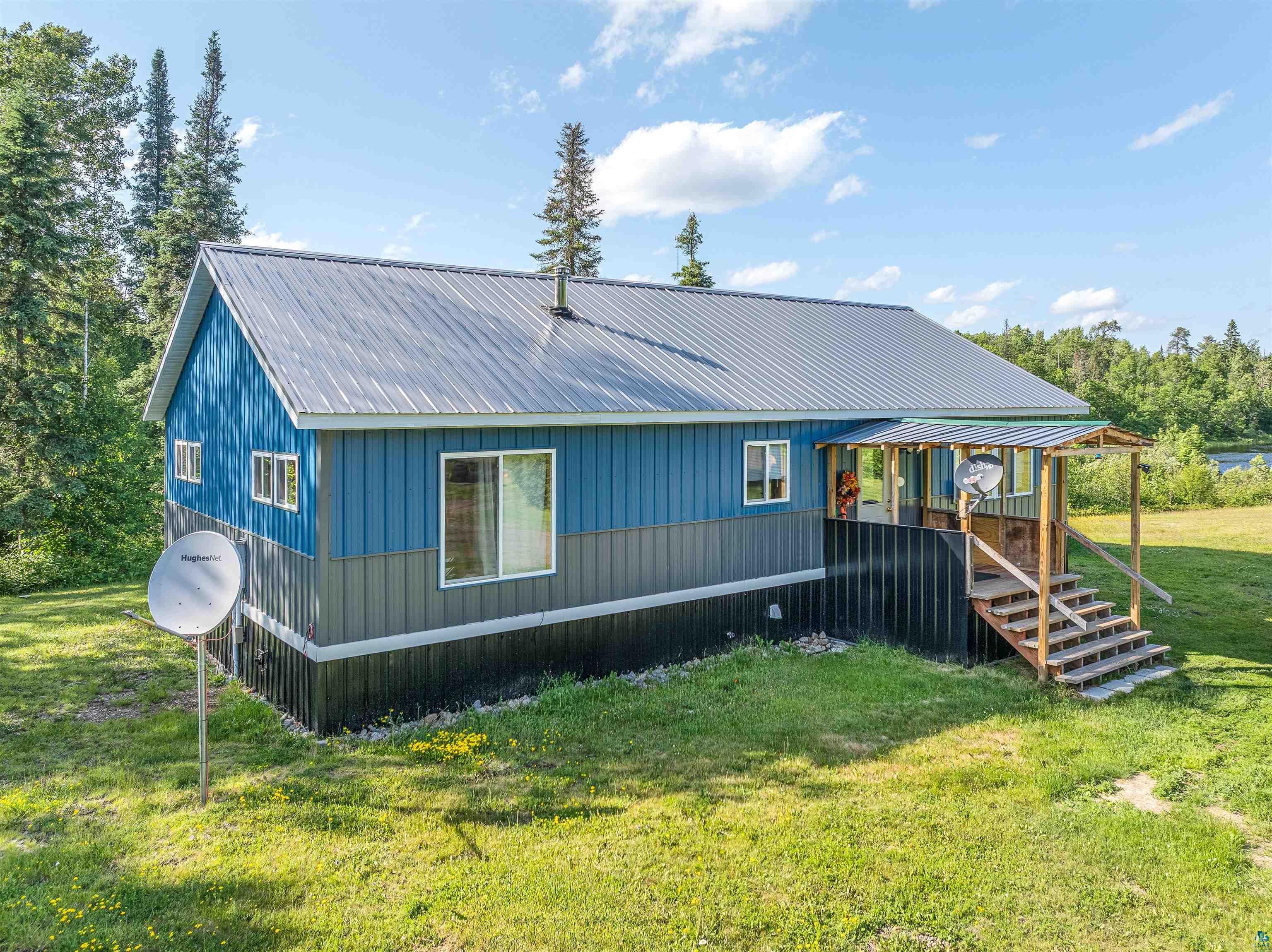 1383 Kelly Trail Isabella, MN 55607 - Photo 39 of 40 Back of property featuring a yard and a metal roof