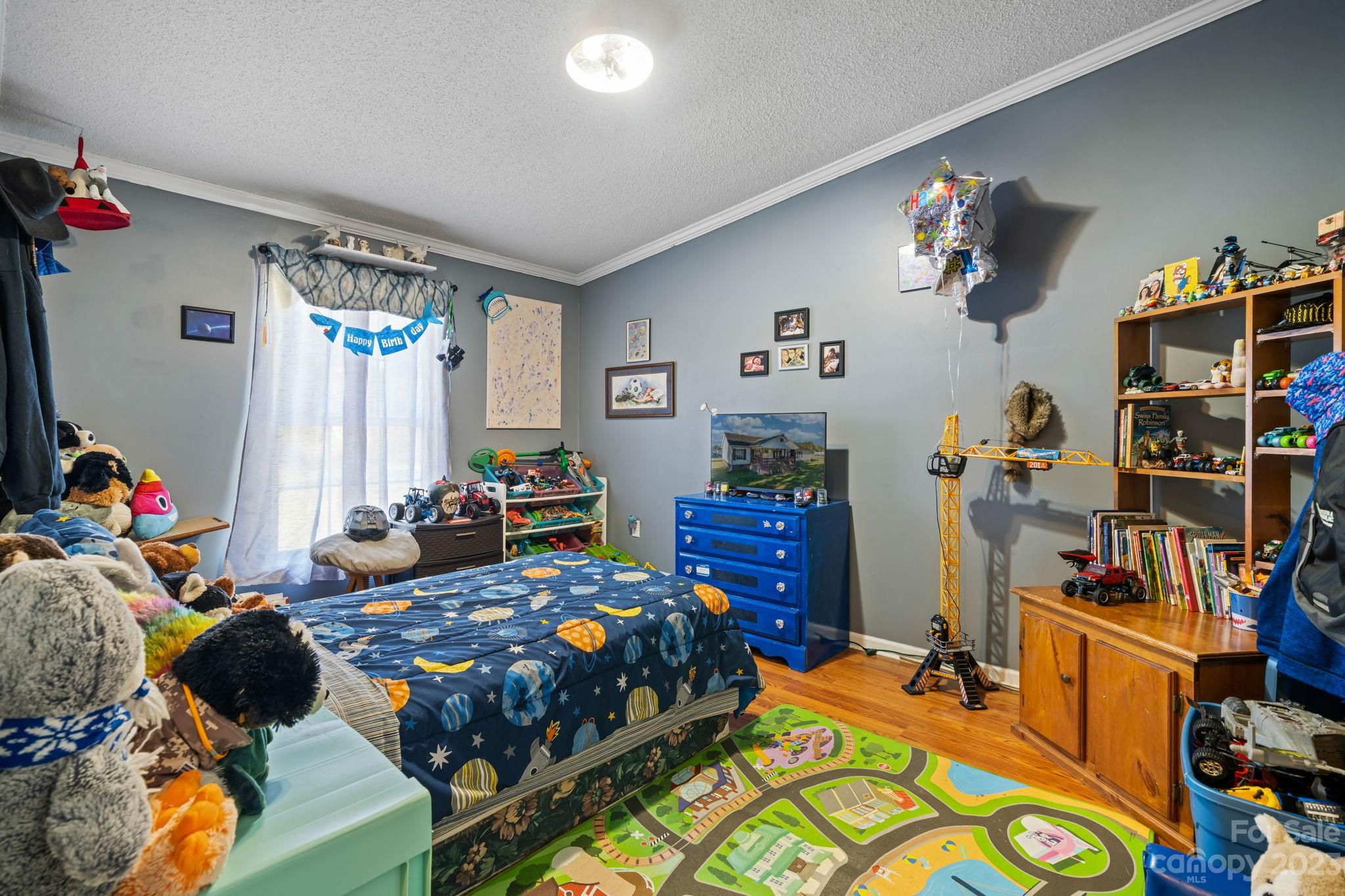 160 Bost Nursery Road Maiden, NC 28650 - Photo 17 of 27 a bed room with bed and a window
