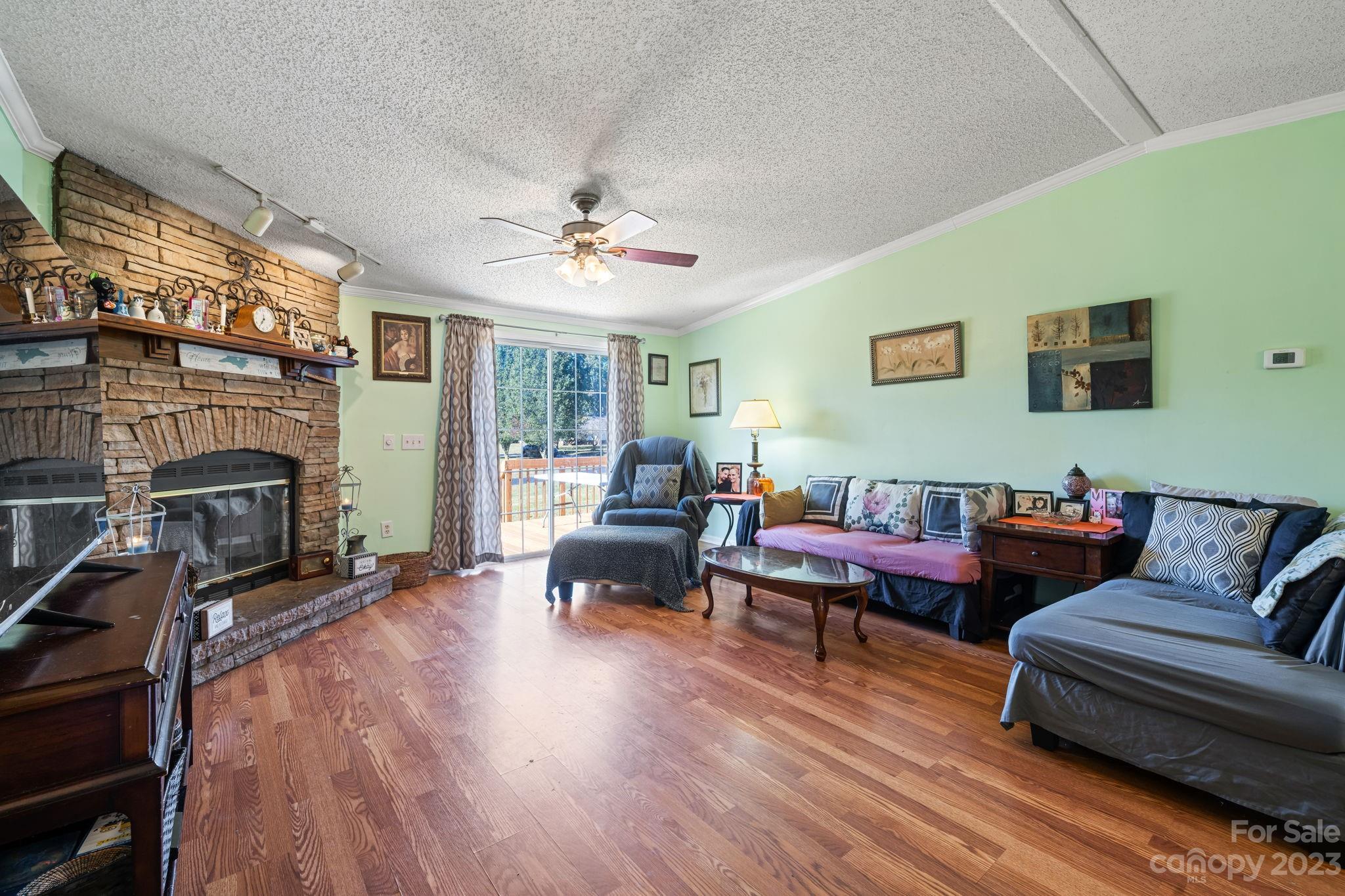 160 Bost Nursery Road Maiden, NC 28650 - Photo 8 of 27 a living room with furniture and a fireplace
