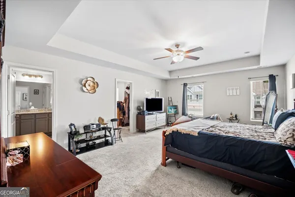 a bedroom with a bed and a couch