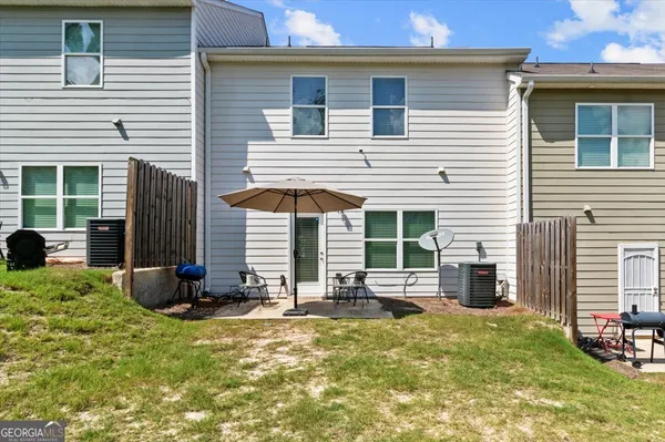 a front view of a house with a patio