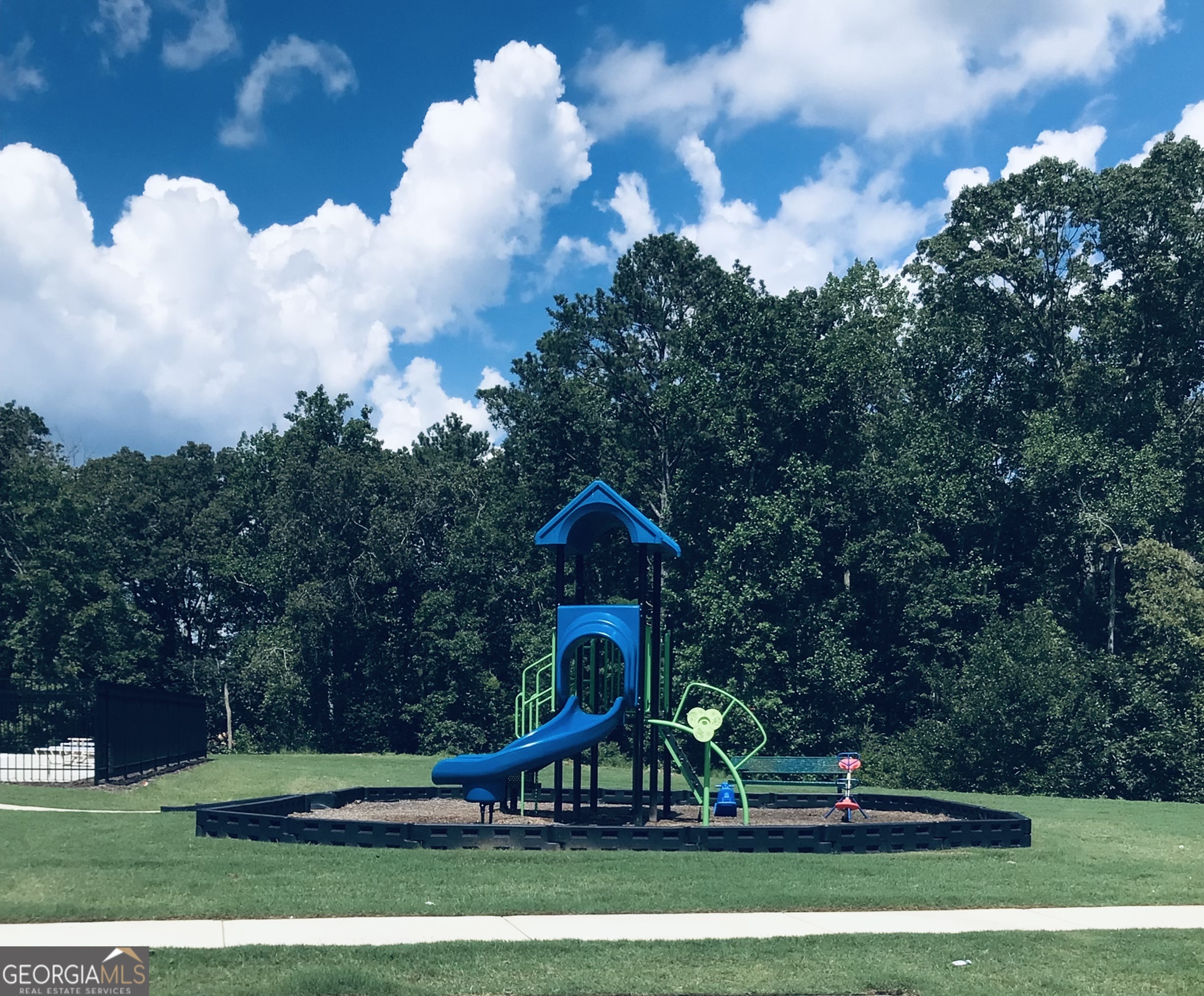 7503 Knoll Hollow Road Lithonia, GA 30058 - Photo 25 of 34 a front view of a house with a yard and potted plants