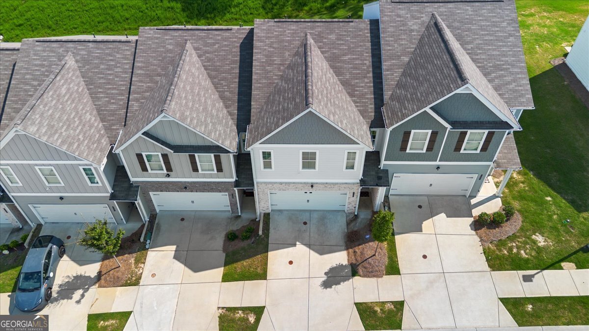 7503 Knoll Hollow Road Lithonia, GA 30058 - Photo 3 of 34 a aerial view of a house with a garden